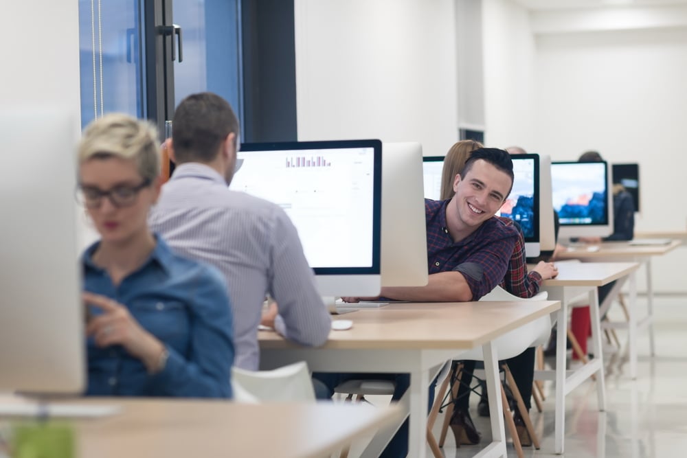 startup business, software developer working on desktop  computer at modern office